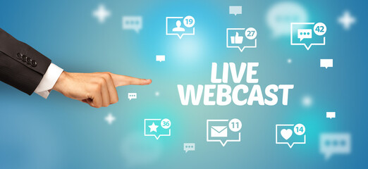 close-up of cropped hand pointing at live webcast inscription, social networking concept