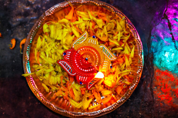 Wall Mural - Indian Festival Diwali , lamp and marigold flower petals in pooja thali