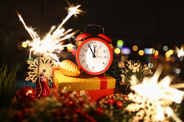 Wall Mural - Hands on red alarm clock show time of new year's celebration. New years eve and christmas concept.