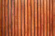 Old vintage red brown wood lath wall cladding for background and texture images.