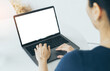 © panitan - computer mockup blank screen.hand woman work using laptop with white background for advertising,contact business search information on desk at coffee shop.marketing and creative design