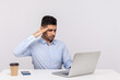 © khosrork - Yes sir! Responsible disciplined serious employee sitting office workplace, giving salute to laptop screen, listening to his boss giving order on video call. studio shot isolated on white background