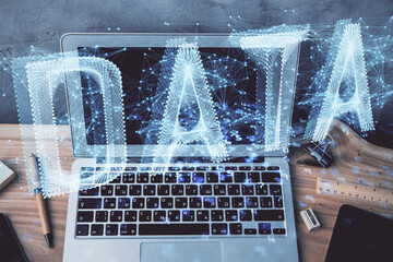 double exposure of desktop computer and technology theme hologram. concept of software development.