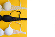Bra of beige, white and black color on yellow background, space for text. Template for text with women's lingerie collection