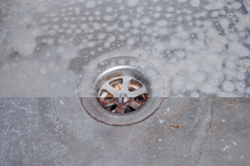 Wall Mural - Photo of the drain hole of the kitchen sink before and after applying the active detergent