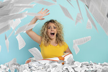 Blonde Girl Is Surrounded By A Lot Of Paper Sheet And Asks For Help . Concept Of Bureaucracy And Overwork