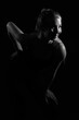 © roman1relax - Girl on a black background in fashionable clothes