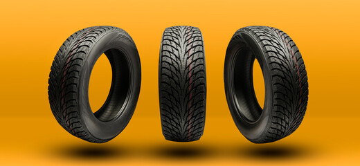 Wall Mural - winter tires friction close-up on a bright yellow-orange background