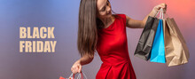 Young Woman In A Red Dress Is Holding Paper Shopping Bags In Her Hands. The Words Black Friday Are Written Next To It. Concept Of Shopping And Sales