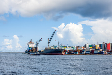 Cargo ships in the port of Male city, the capital of the Republic of Maldives located on an island in the Indian ocean