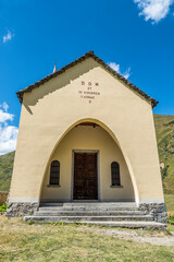 Wall Mural - beautiful little catholic church on top of a hill in the mountains in Formazza Valley