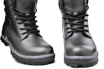 Winter men's black leather shoes on a white background, hiking shoes, practical off-road shoes, close-up details of the model, close-up