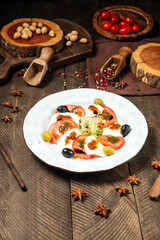 Wall Mural - Side view on gourmet caprese salad in white plate