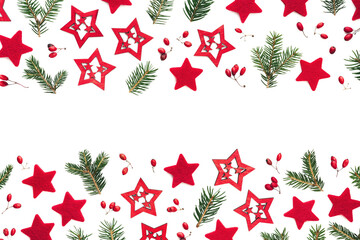 Wall Mural - Christmas Arrengement With Red Stars And Pine Green Twigs On White Background