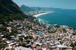 © EZ PHOTOS - Aerial view of the city of Rio de Janeiro from the top of the Vidigal mountain, Rio de Janeiro, Brazil. Horizon under blue sky. Travel destination exotic culture concept.