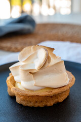 One piece of lemon tart with white eggs meringue