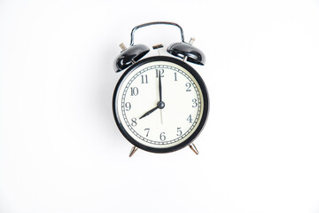 Wall Mural - black alarm clock with white dial, shows 8.00 on a white background