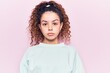 © Krakenimages.com - Beautiful kid girl with curly hair wearing casual clothes with serious expression on face. simple and natural looking at the camera.