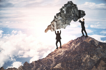 Canvas Print - Two businessmans holding rock