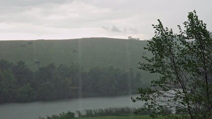 Canvas Print - Rain over a farm