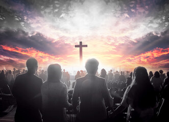 Wall Mural - worship concept: christian people hand in hand over cross on spiritual sky background