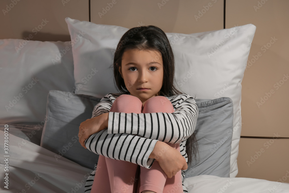 Little girl suffering from sleep disorder in bedroom