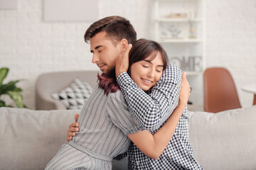 Poster - Happy couple hugging after quarrel at home