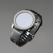 © Mikhail Rychkov - Wireless smart watch in a round matte black case with risks on the rim and a silicone strap on a gray background.