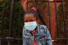 Adorable Black Kid Wearing Blue Surgical Mask Outside Close Up 