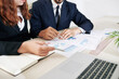 © DragonImages - Cropped image of financial analysts discussing charts and reports at meeting when working on stategy of development