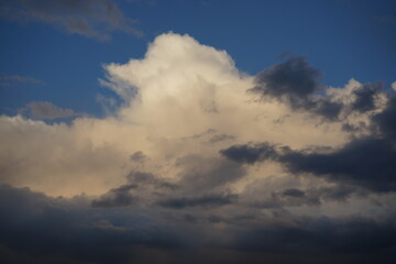 Wall Mural - blue sky with clouds. dramatic sky. an impending thunderstorm. thunderclouds at sunset. dark clouds 