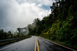 © Kittiphat - Countryside road passing through the serene lush greenery and foliage tropical rain forest mountain landscape on the Doi Phuka Mountain reserved national park the northern Thailand