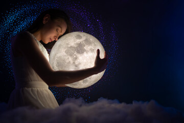 Wall Mural - girl in white air dress with the moon. beautiful tender girl on the night sky with bright stars and 