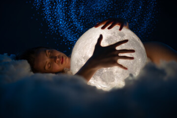 Wall Mural - young attractive girl sleeping on the soft cloud and hugs the bright white moon. girl with the moon 