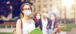 © Syda Productions - education, pandemic and people concept - teenage student girl wearing face protective medical mask for protection from virus disease with school friends