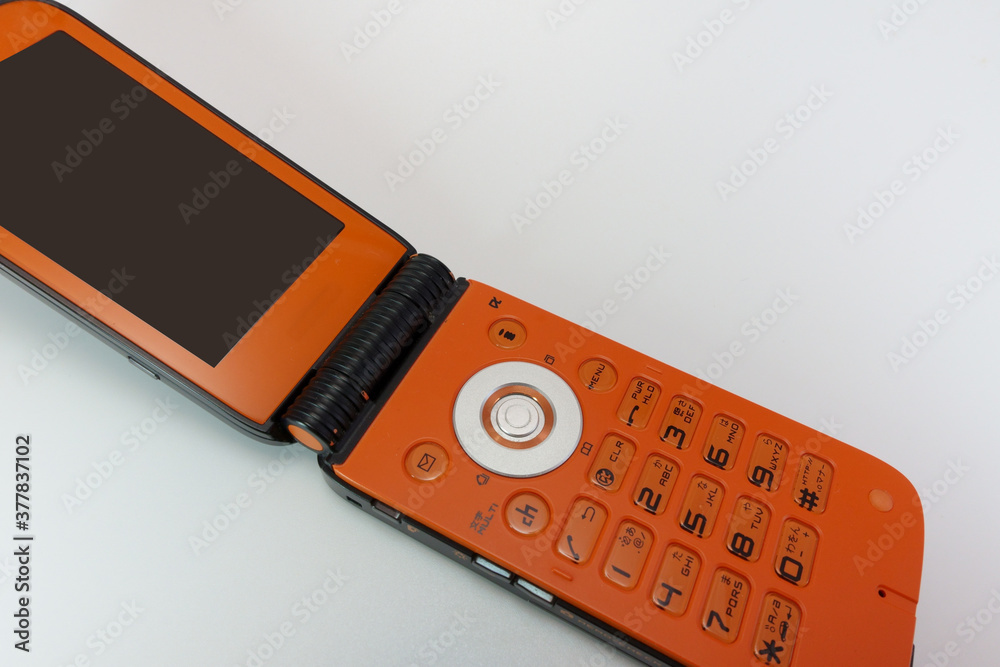 オレンジと黒の折り畳み式ガラケー の Stock フォト | Adobe Stock