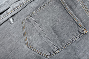 Grunge denim jeans texture background. Grey cotton fabric texture.