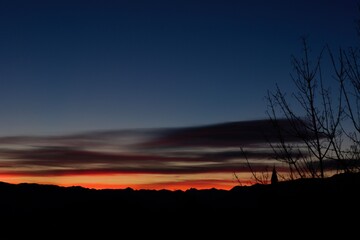 scenic orange sunset in Trentino mountains silhuette blu hour no people copy space