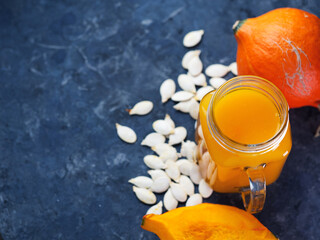 Wall Mural - Natural homemade pumpkin juice in a jar on the table with ingredients copy space