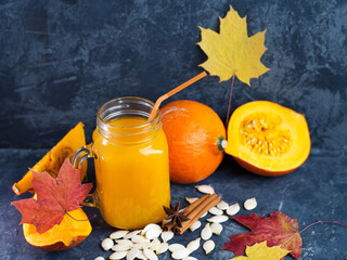Wall Mural - Natural homemade pumpkin juice in a jar on the table with ingredients