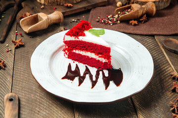 Wall Mural - Red velvet cake decorated with chocolate sauce