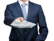 © Alekss - Businessman holding money cash in hands of passing them to the client.
