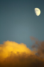 Moon And Yellow Clouds With Blue Sky