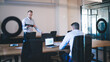 © BullRun - Confident male entrepreneurs cooperating on common project communicating using digital devices, caucasian 20s men colleagues in smart casual clothes analyzing information about project at consultancy