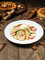 Wall Mural - Side view on caesar salad with chicken and iceberg