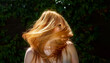 © ullision - Sensual sexy portrait of beautiful redheaded woman shakes her hair outdoors with ivy background, copy space