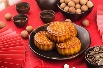 Poster - Mid-Autumn Festival concept, Traditional mooncakes on table  with teacup.