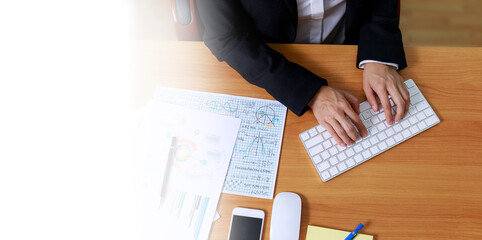 Wall Mural - Business and financial concept  Top view hands of business women use keyboard PC computer . Business people typing computer keyborad. with copy space banner