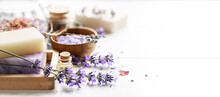 Lavender's Soap Bars And Spa Products With Lavender Flowers On A White Table.