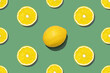 © Papin_Lab - Top view of fresh lemon seamless pattern on green or olive background. Many sliced yellow lemon and one full on center seamless texture background. Fruit minimal concept.